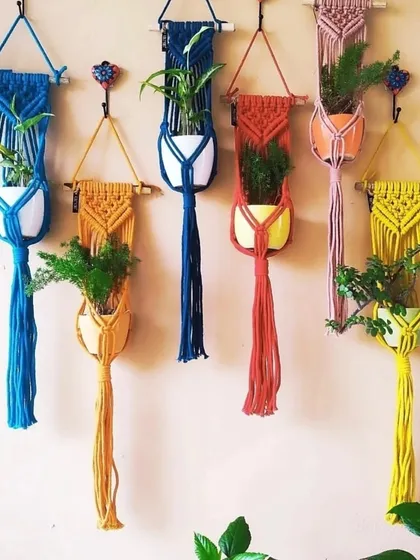 Give your plants a boho home. I craft these macrame plant hangers in a variety of colors and designs, perfect for adding a pop of color and texture to your balcony, window, or any corner of your home. Each one is made from durable cotton cord to securely hold your pots.