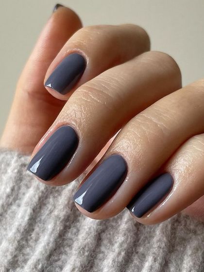 A chic and understated slate grey polish. This color is modern, versatile, and looks great on shorter, square-shaped nails.