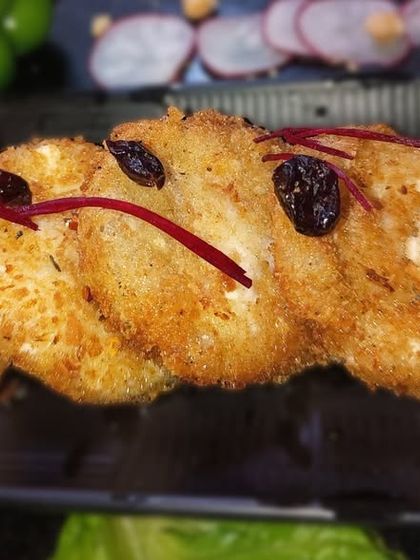 Our version of the classic Dahi Bhalla, presented in a modern way. The crispy bread element adds a delightful crunch to the soft, yogurt-soaked lentil fritters.