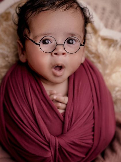 A look of surprise from our little wise one. Capturing these awake moments during a themed shoot adds so much personality to the gallery.