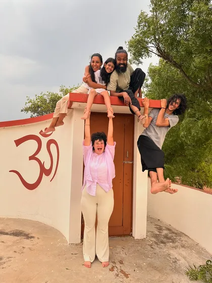 A playful and creative group photo on the ashram roof. We are a family that supports each other, literally and figuratively!