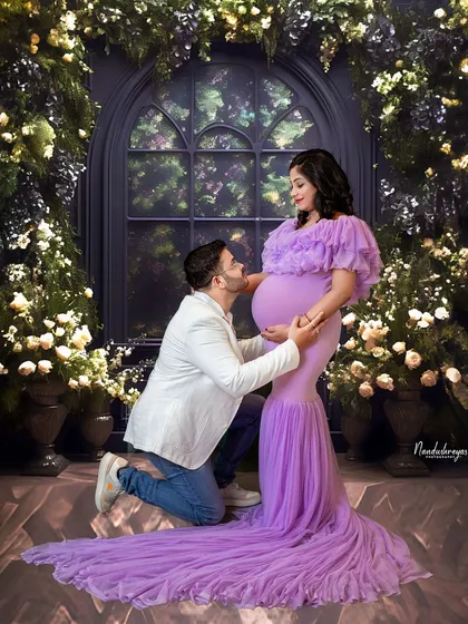 In my studio, we can create any world you imagine. This fairytale setting, with its floral arch and soft lighting, is perfect for capturing those tender moments of connection and anticipation between you and your partner.