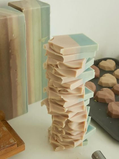A tall, wobbly stack of freshly cut soap ends, a common sight in my studio.
