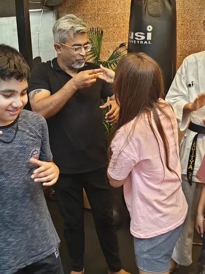 My husband and I interacting with my students during the birthday celebration. It takes a village, and I am so grateful for the supportive community we have built.