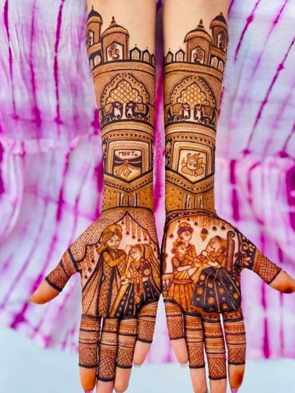 This design is a tribute to sisterhood, featuring portraits of the bride with her sister, along with a doli and Ganesha.