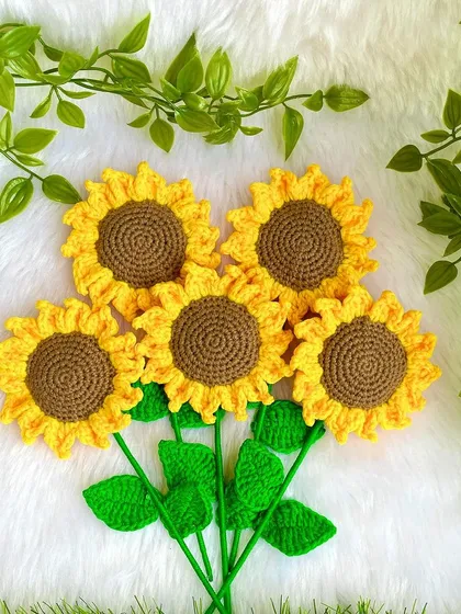 A cluster of the five crochet sunflowers, ready to be arranged into a beautiful, lasting bouquet.