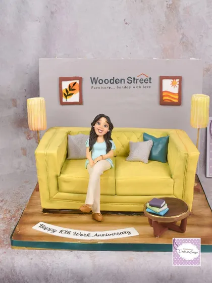 The full view of the sofa cake, showing the entire edible room setup.