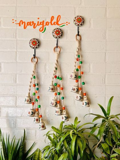 Our 'Symphony Chimes' in the 'Marigold' color combination. The orange and green beads create a warm and inviting look, perfect for festive occasions or as a thoughtful gift.