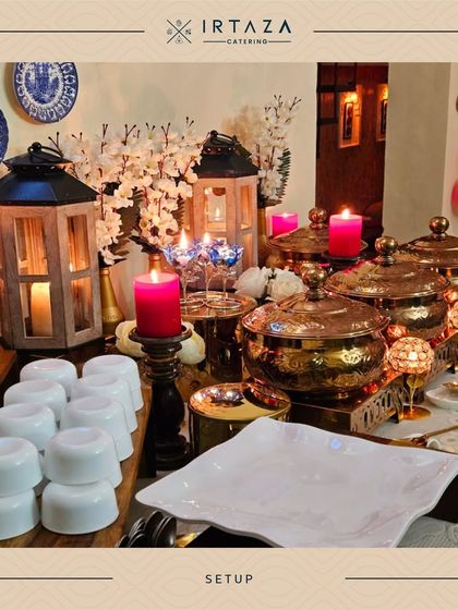 A charming setup featuring wooden lanterns and decorative plates, perfect for creating a rustic yet elegant feel for your event.