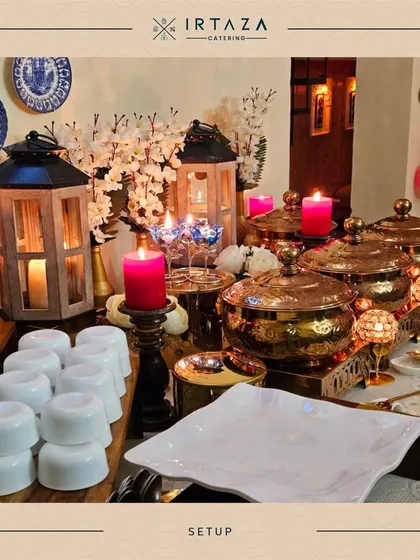 Another look at a festive home party setup. I used wooden lanterns and bright pink candles to create a vibrant and welcoming display for guests.