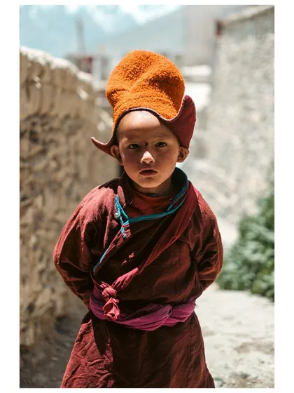 The innocent yet profound gaze of a young monk in Karsha, Zanskar Valley. For me, portrait photography is about connecting with a person's story and reflecting their spirit in a single frame.