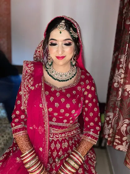 My gorgeous bride Sidra, ready for her Nikah. The bright pink outfit is paired with a matching lip and beautiful green jewelry.