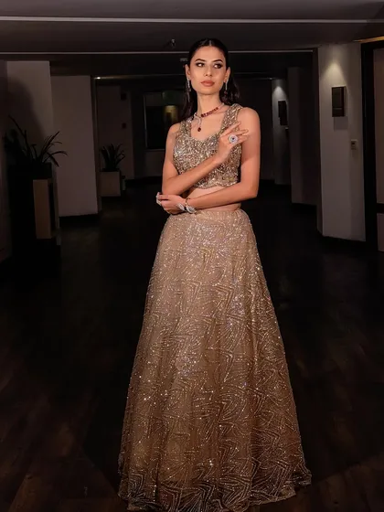Another pose in this gorgeous modern glam outfit. The makeup is designed to look perfect from every angle, whether you're on the dance floor or posing for photos.