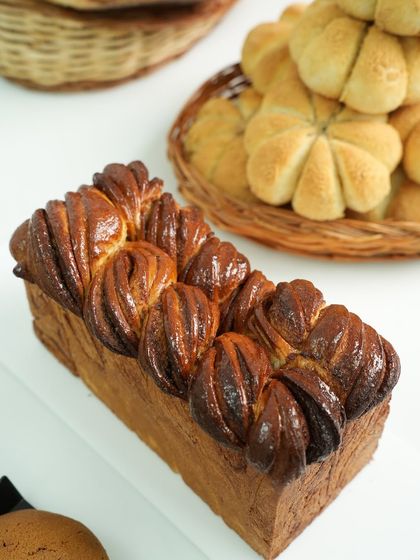 A stunning braided chocolate babka loaf. This enriched bread is as beautiful as it is delicious, and a favorite in our bread-making classes.
