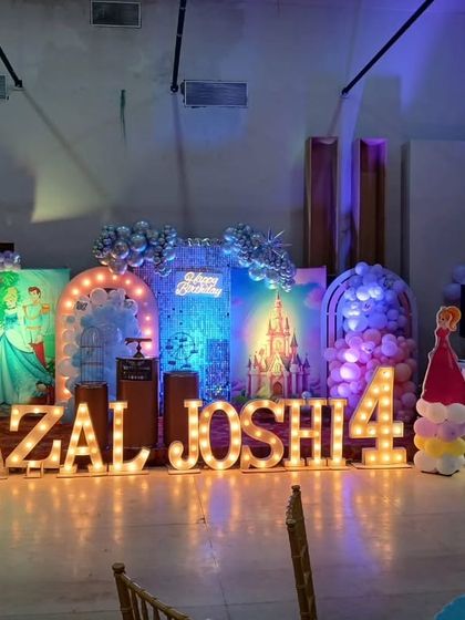 The stage decor under different lighting, showing its versatility and visual impact.