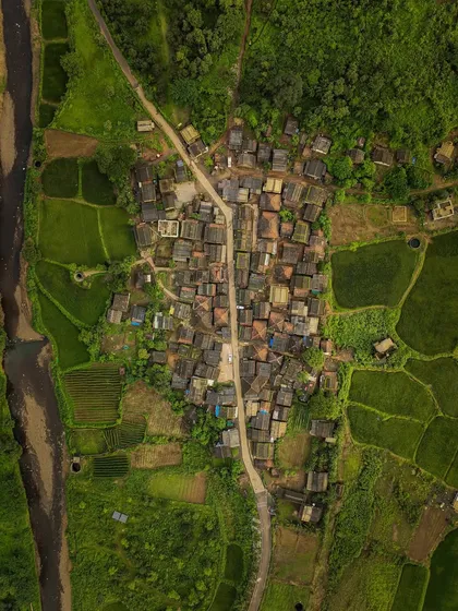 A top-down view of Chinchavali village, nestled between a river and rice paddies. The patterns and textures from this angle are fascinating.