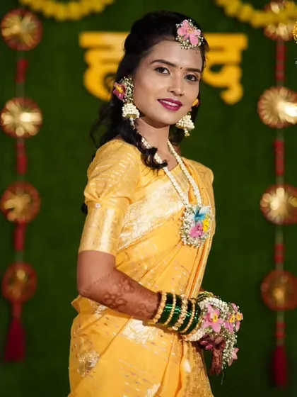 The complete look for this beautiful Haldi bride. Her custom floral jewellery set brings a unique charm and elegance to her traditional attire.