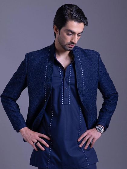 Celebrate in style with this vibrant blue Indo-Western set. The intricate embroidery and luxurious details make it a stunning choice for any festive collection.