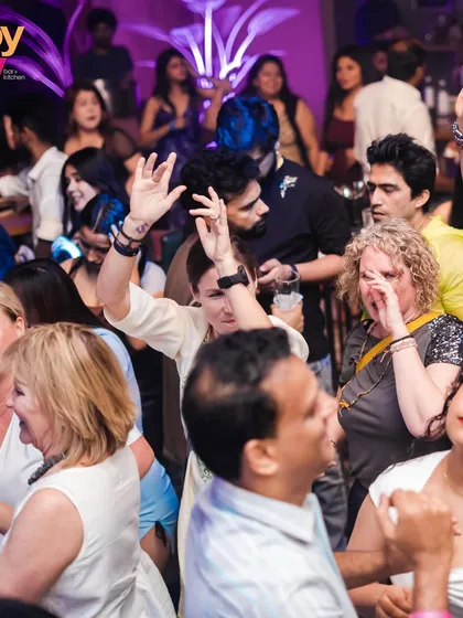 A diverse crowd dancing together. Music unites everyone on my dance floor, creating a fantastic, inclusive atmosphere.