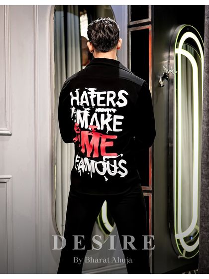 Unapologetic, unfiltered, unstoppable. The back of this shirt says it all, for the man who knows the spotlight follows him.