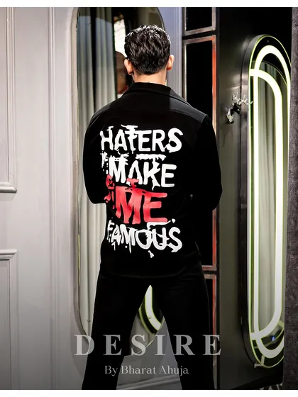 Unapologetic, unfiltered, unstoppable. The back of this shirt says it all, for the man who knows the spotlight follows him.