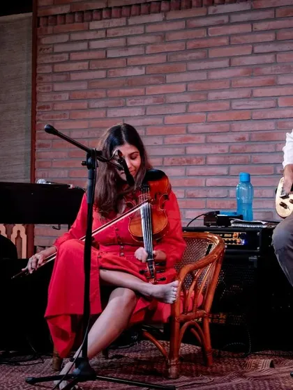 A focused shot of the REFUGE trio, Aman Mahajan, Apoorva Krishna, and Dhani Muniz, during an intricate musical passage at the Jazz Festival.