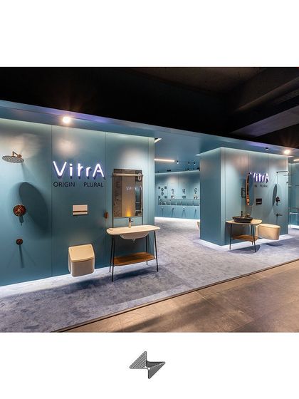 This image shows the transition between different product zones, unified by the consistent color palette and flooring, ensuring a smooth customer flow.