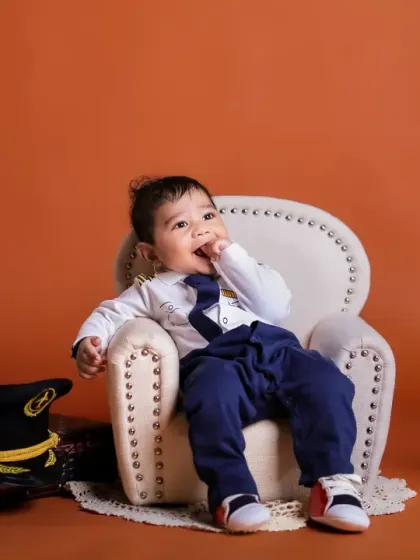 A thoughtful moment for our little pilot. We capture a range of expressions, from playful to pensive, during our themed sessions.