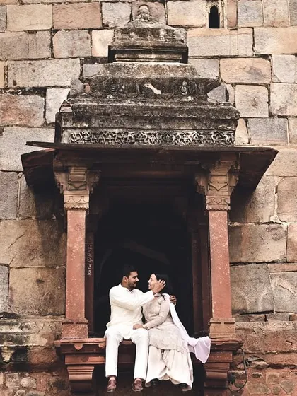 Using the architectural details of a historic monument, we framed this couple in a window for a timeless, regal portrait. These locations provide a majestic backdrop for pre-wedding photography.