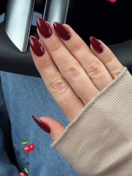 A beautiful, deep cherry red on sharp almond-shaped nails. This is a perfect color for any season.