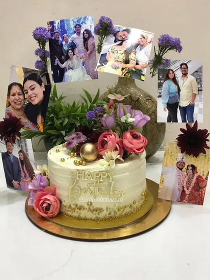 I believe cakes should be as personal as the memories you're celebrating. This photo ring cake is one of my most requested designs. It features a beautiful floral arrangement surrounding cherished family photos, making it a heartfelt centerpiece for a birthday celebration.