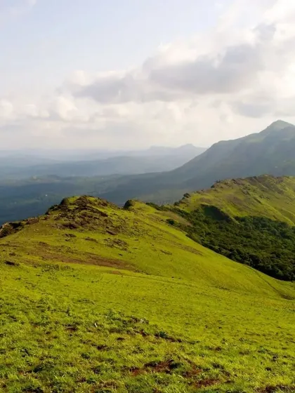 The rolling green hills of Chikmagalur, a perfect destination for a leisure trip with friends and family.