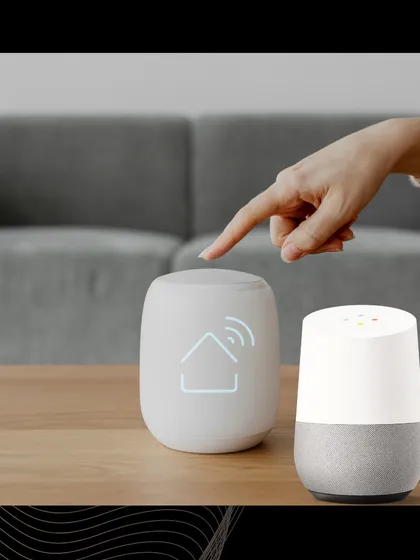 We empower your home with the intelligence of leading voice assistants. This image shows a central smart home hub alongside a Google Home device, representing the seamless integration that allows you to manage your environment through both touch and voice.