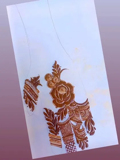 A practice sketch of a palm design centered around a large rose. This helps me plan the placement and flow of the design.
