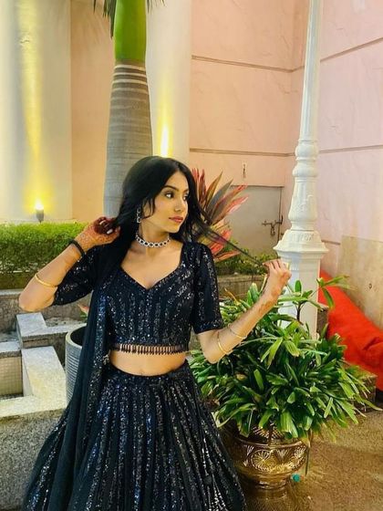 Another angle of this versatile black rental lehenga, perfect for any evening celebration.