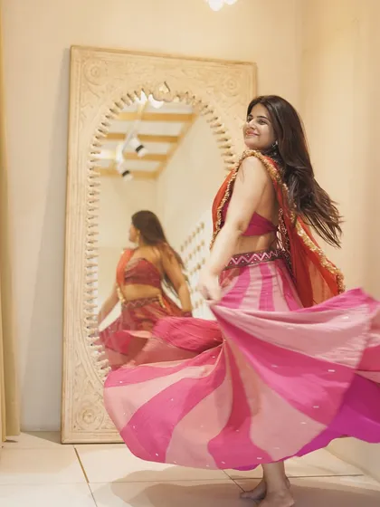 A candid moment of me dancing, captured in the mirror. This pink and orange lehenga has such a beautiful flare, perfect for Garba.