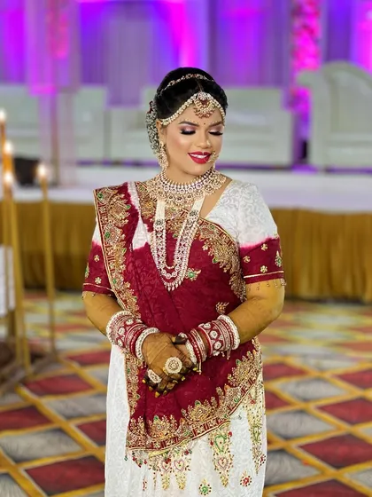 A beautiful shot of the bride on her wedding day, with the venue's lighting making her jewellery sparkle.