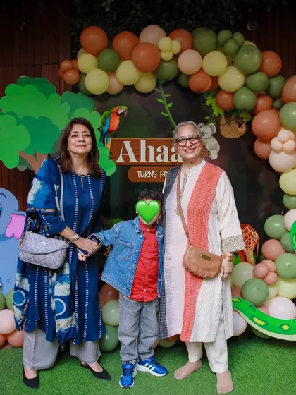 Family and friends gather for a photo at the jungle safari party. Our backdrops are large enough to accommodate group pictures.
