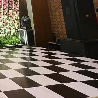 A view of the professional sound system and checkered dance floor. We ensure that the technical production is as flawless as the decor.