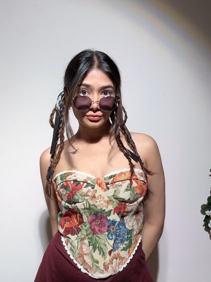 A full view of the floral corset. The structure and pattern make it a standout piece that requires minimal styling to look great.