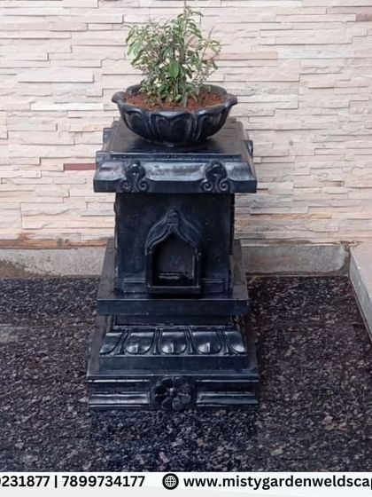 We also integrate cultural and spiritual elements into our garden designs. This traditional Tulsi stand is placed on a granite platform, creating a sacred corner within the backyard.