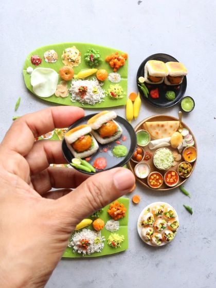 A collection of my miniatures, including vada pav and a South Indian meal.