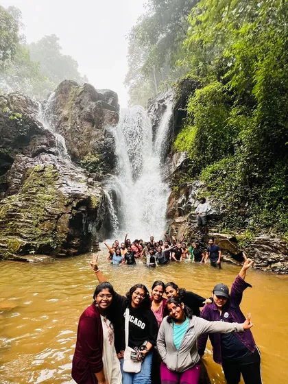 Another angle of our group having a blast in the waterfall pool on a Bandaje trek trip.