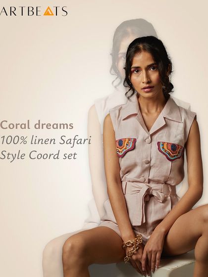 The Coral Dreams safari-style co-ord set, crafted from 100% pure linen. The shorts and sleeveless top feature pockets detailed with my embroidered artwork, blending utility with artistry.