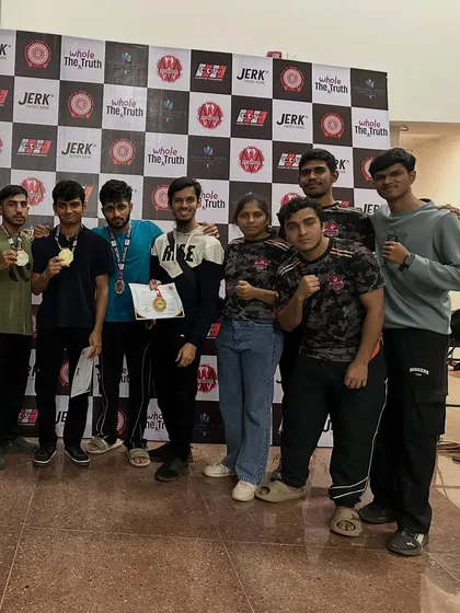 The team after the Real Cage Championship. We stand together, celebrating our wins and learning from our losses.