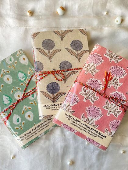 A set of three of our beautiful handmade journals, featuring traditional block-printed fabric covers. The paper inside is 100% recycled.