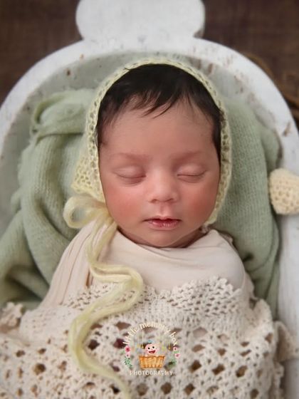 This little peanut is so cozy in this rustic bowl. I use a variety of props and textures, like this crochet blanket and bonnet, to add warmth and interest to the photos.