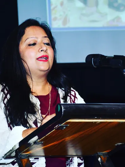 Our host, Bhumika Badani, eloquently guides the audience through the evening's performances and ceremonies during our 4th Annual Day.