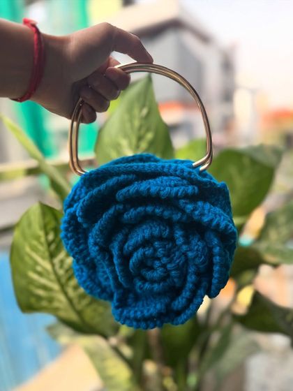 Our Peony Bag in a vibrant blue. This color is so eye-catching and perfect for making a style statement.