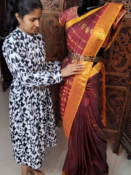 Here I am demonstrating how to drape a pre-pleated saree on a mannequin. This is a key part of my professional training course for aspiring saree drapists.